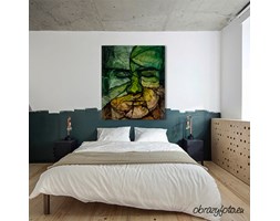 Face of man from leaves with closed eyes
